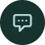 A green speech bubble icon with three dots inside, centered on a dark background, indicating a chat or messaging feature for SeniorConcierge St.Louis Seniors.